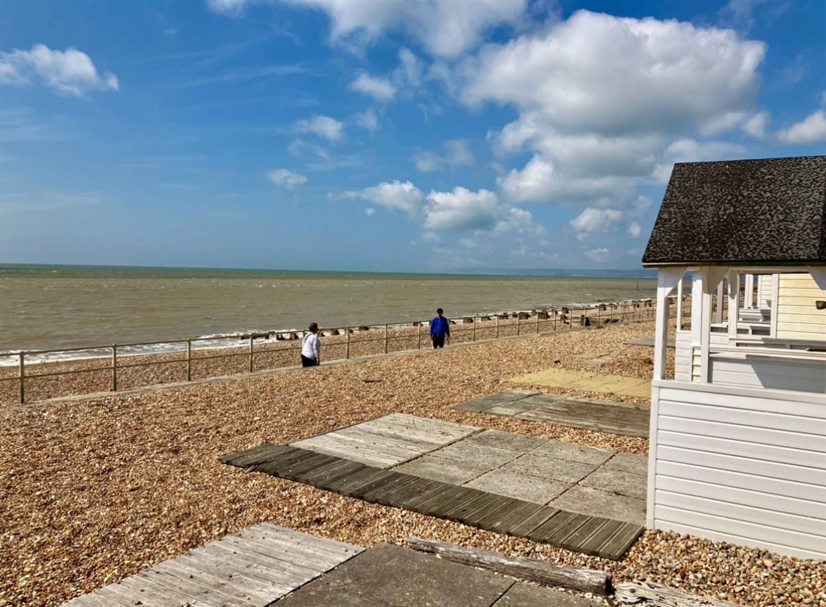 View to the right standing at the front of beach hut