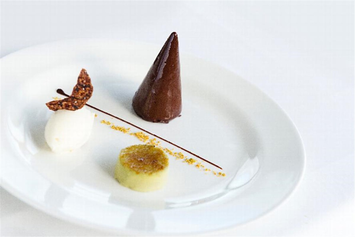 Chocolate mouse and pistachio creme brulee, marzipan ice cream