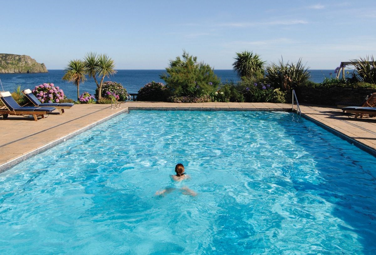 The warm outdoor pool has views out to sea