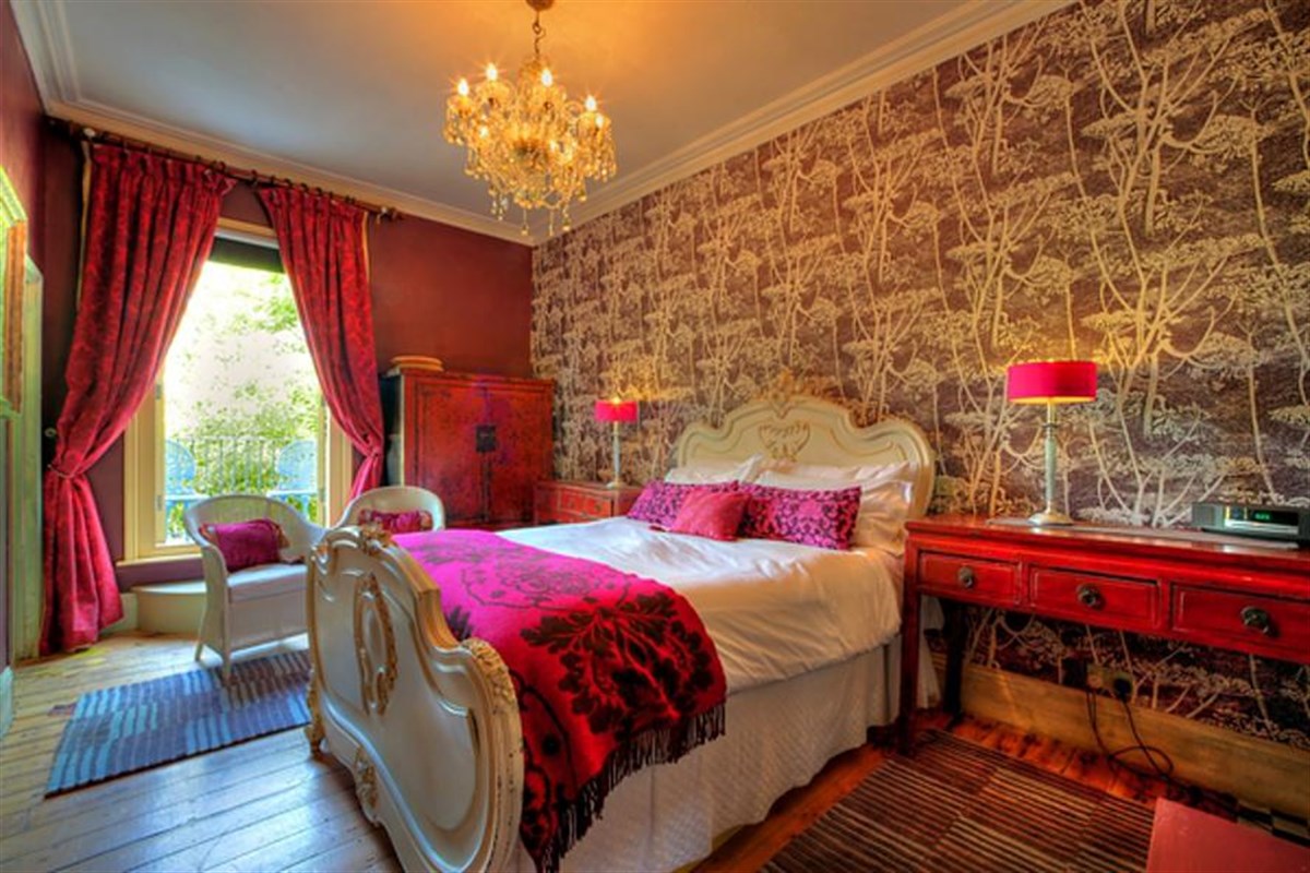 Fantouche bedroom with balcony at Strattons