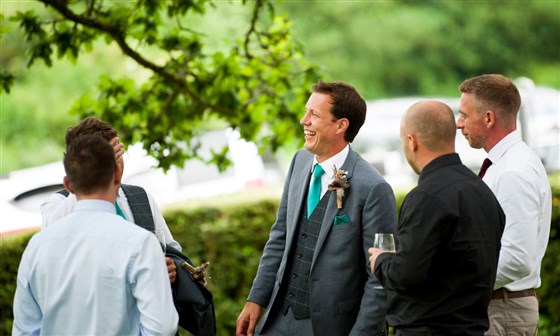 Groomsmen sharing a happy moment