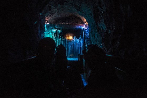 Sailing towards the magical underground waterfall at King Arthur's Labyrinth ├âÔÇÜ├é┬®Visit Wales