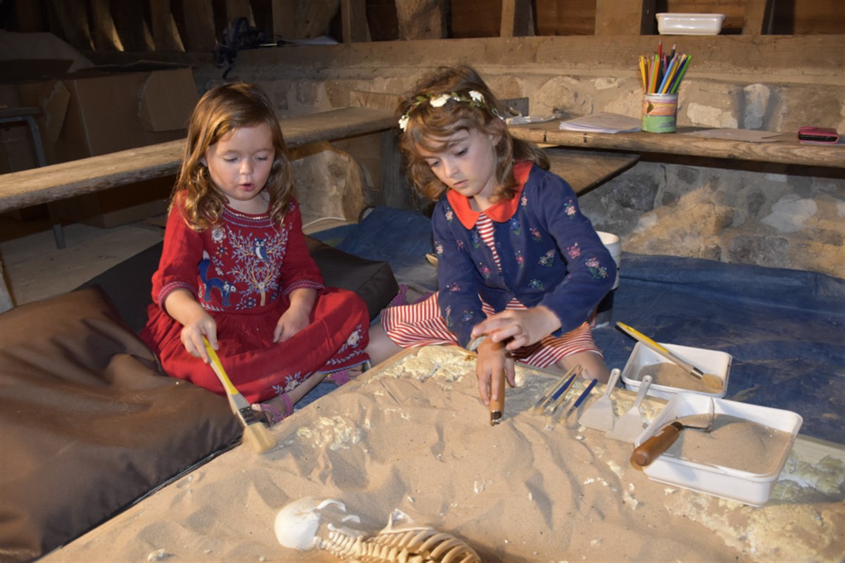 Children excavating a replica skeleton at Alexander Keiller Museum Avebury, Wiltshire ©National Trust Images/Abby George