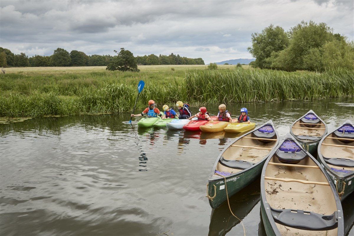 Children canoeing on the river at Attingham Park, Shropshire <span style='font-size:8px;'>®National Trust Images/Arnhel de Serra</span>