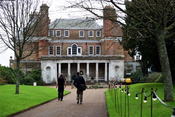 Visitors walking along the footpath towards the north front of the house. Uppark, West Sussex <span style='font-size:8px;'>®National Trust Images/John Millar</span>