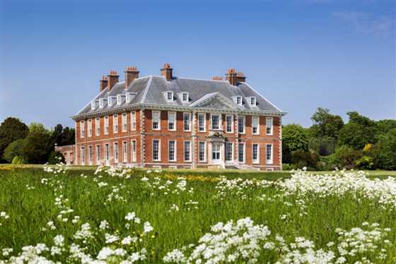 South front of the house from the meadow with white flowers at Uppark House and Garden, West Sussex <span style='font-size:8px;'>®National Trust Images/Andrew Butler</span>