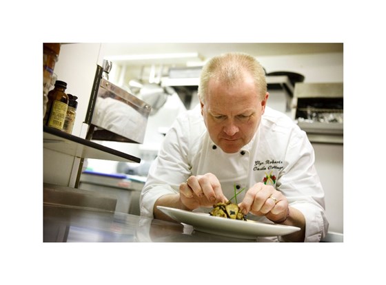 Glyn finishing a dish