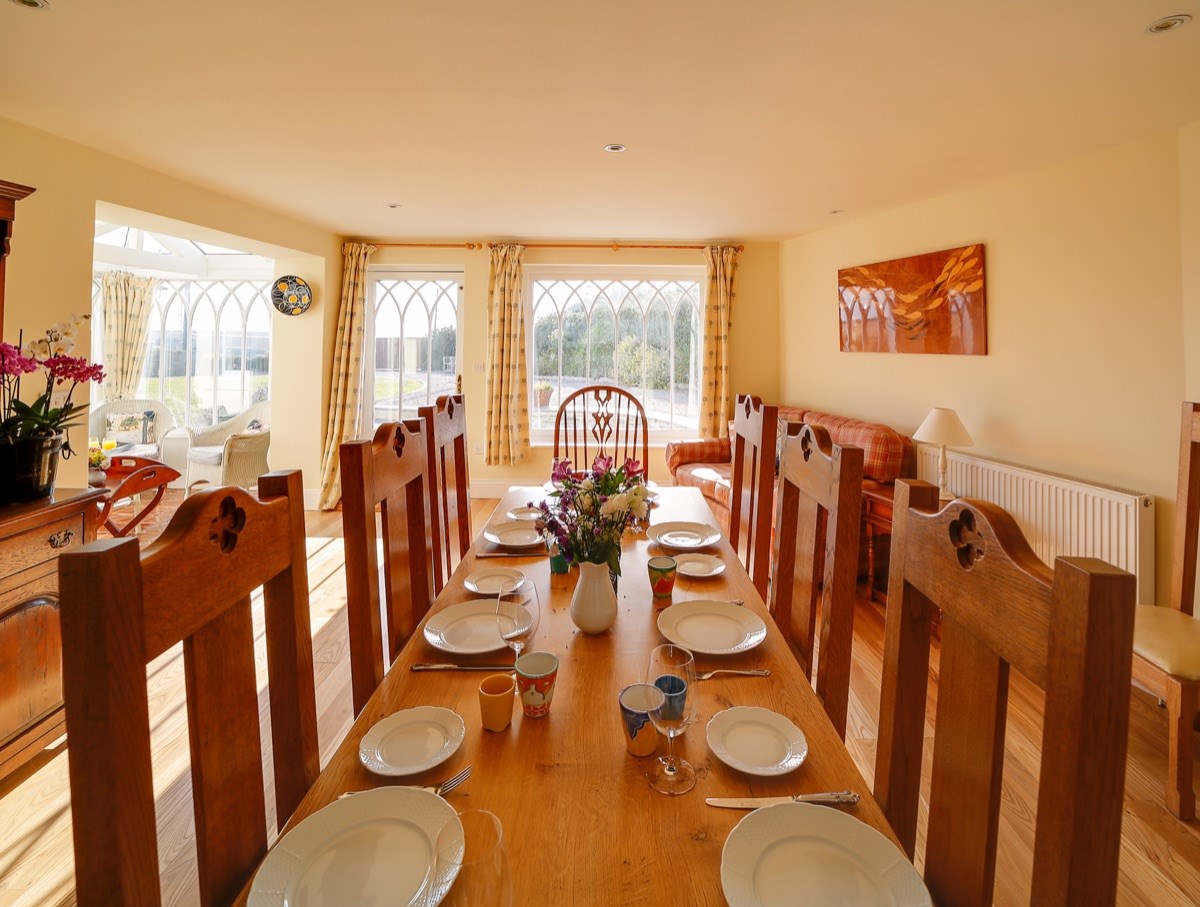 Dining Room. Open plan to Kitchen & Conservatory. Sea & valley views.