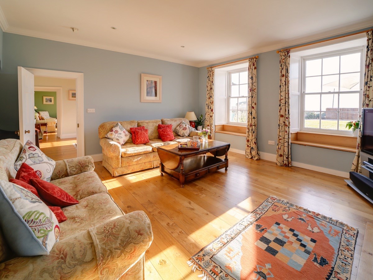 Sitting Room with Drawing room in background (plasma TV, cinema sound system, log fire). 