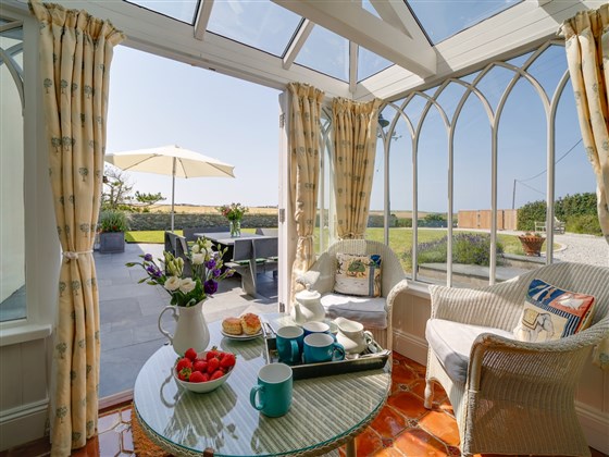 Conservatory. A room for all seasons with views of the beach & valley. 