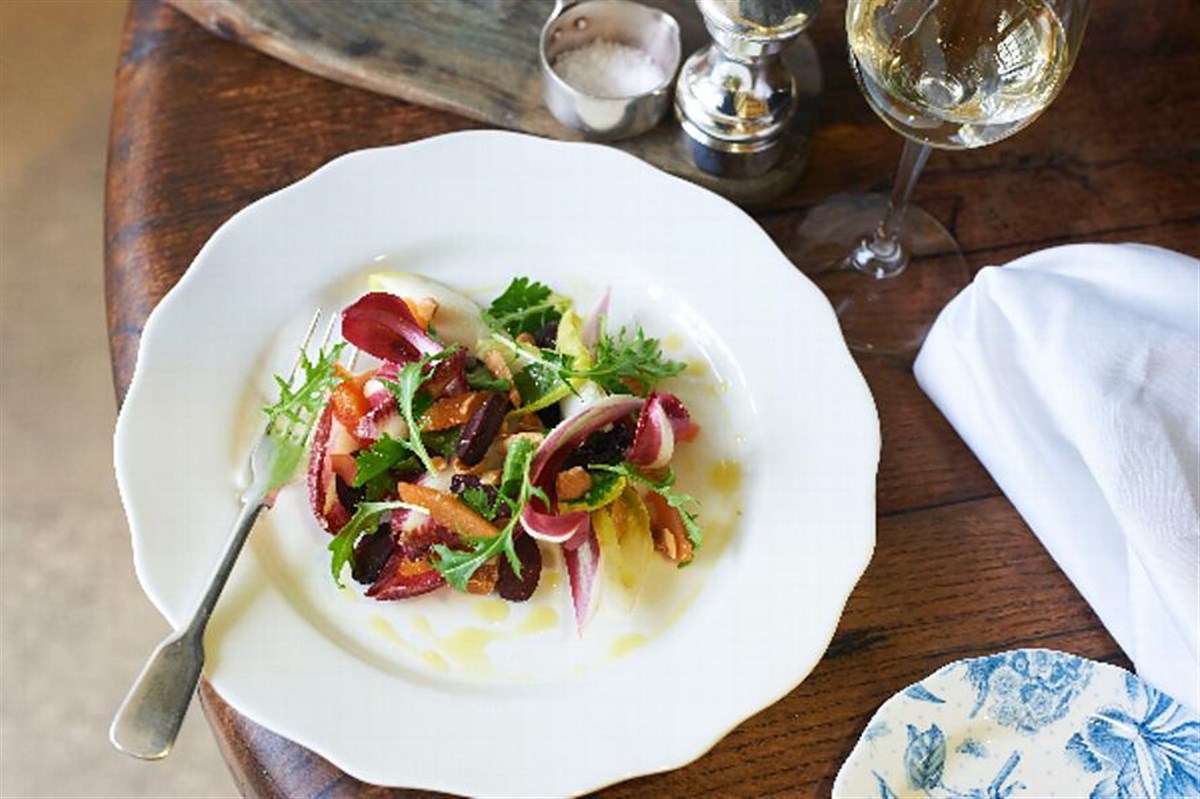 Chicory salad, black olives, salted almonds