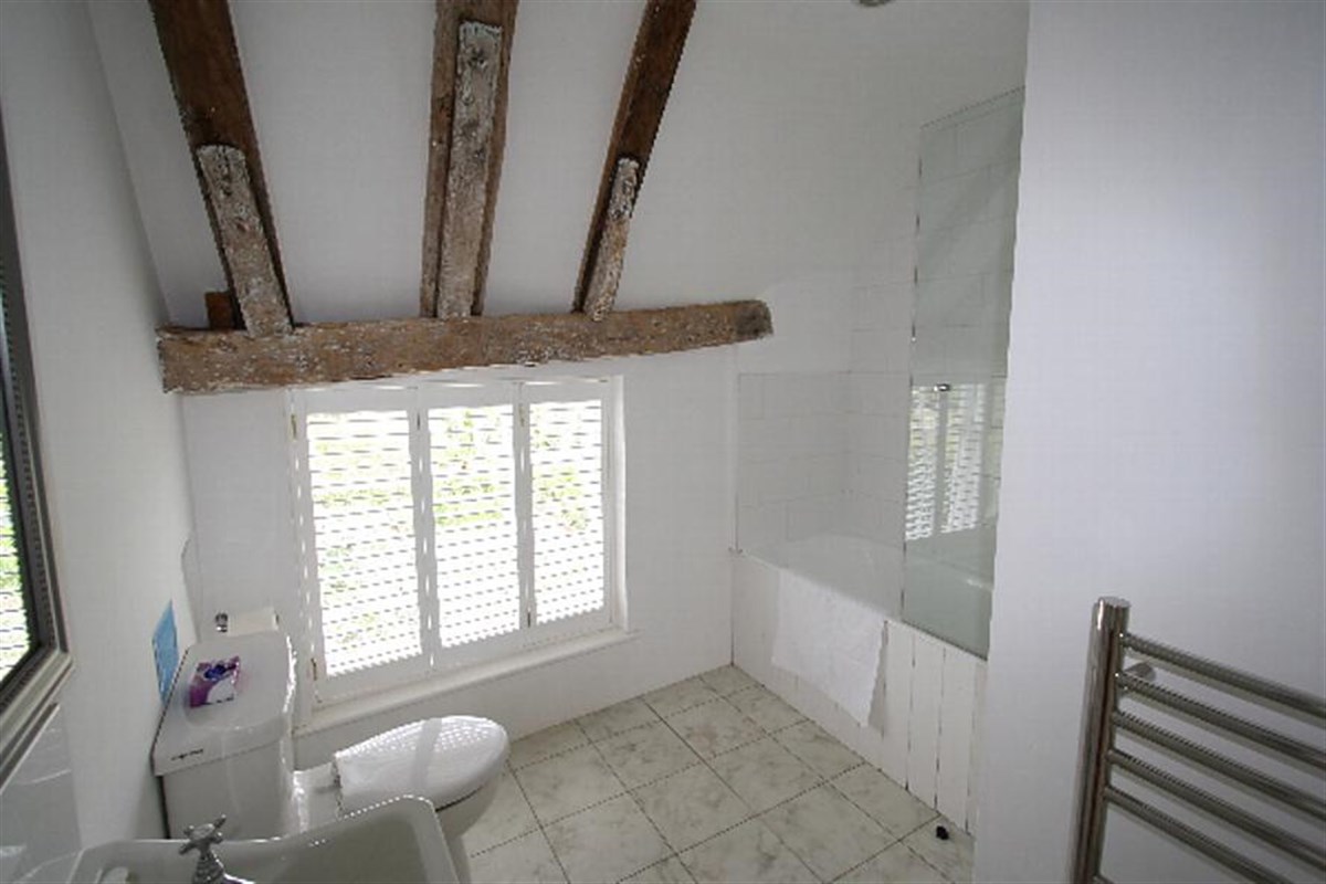 Bathroom with shower over bath