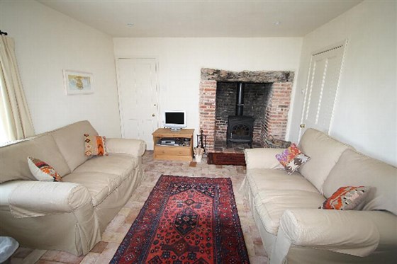 Sitting room with inglenook fireplace & woodburner