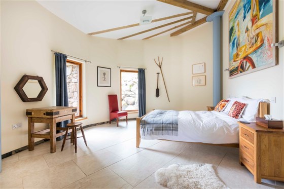 One of the large bedrooms adorned with original works by some of Scotland's finest artists