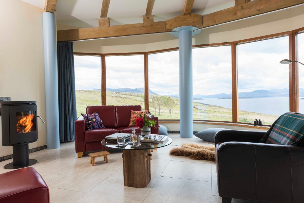 Sitting area with the warm glow of a wood burning stove.