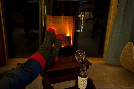 Curl up with a malt by our Danish Rais woodburning stove