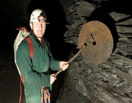 Mark Waite - the Corris Mine Explorers guide banging the blade.