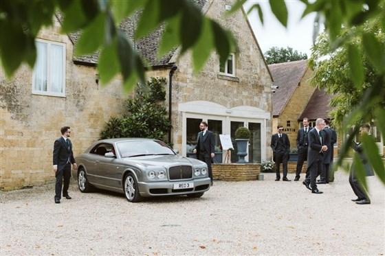 The groom can meet and greet guests at the front of the beautiful barn