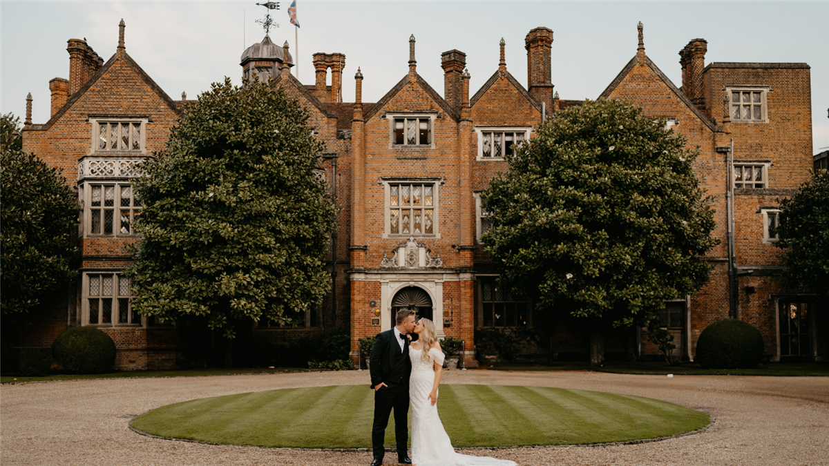 Bride & Groom outside the front of Great Fosters