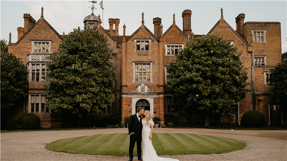 Bride & Groom outside the front of Great Fosters
