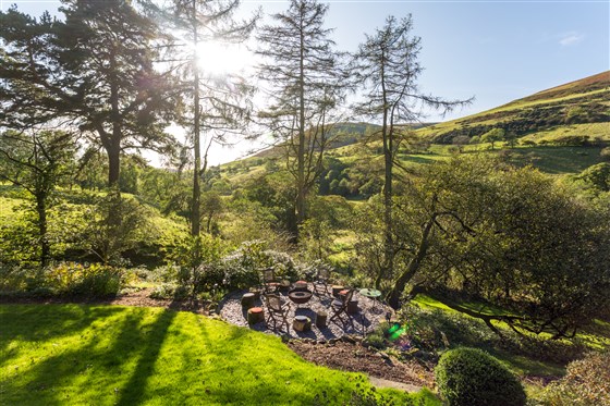 View towards the fire pit & BBQ area