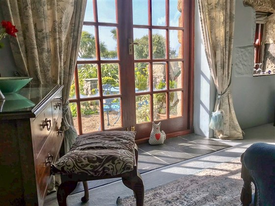 The Blue bedroom has lovely views over the gardens to the sea