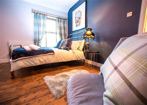 Main Bedroom viewed from Dressing table showing double sized iron bed
