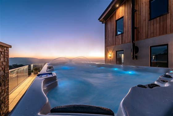 Relax in the swim spa, gaze out across the hills