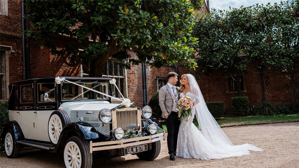 Bride & Groom outside the front of Great Fosters