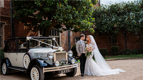 Bride & Groom outside the front of Great Fosters