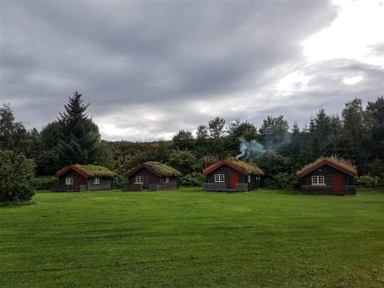 Stay in cozy log cabins