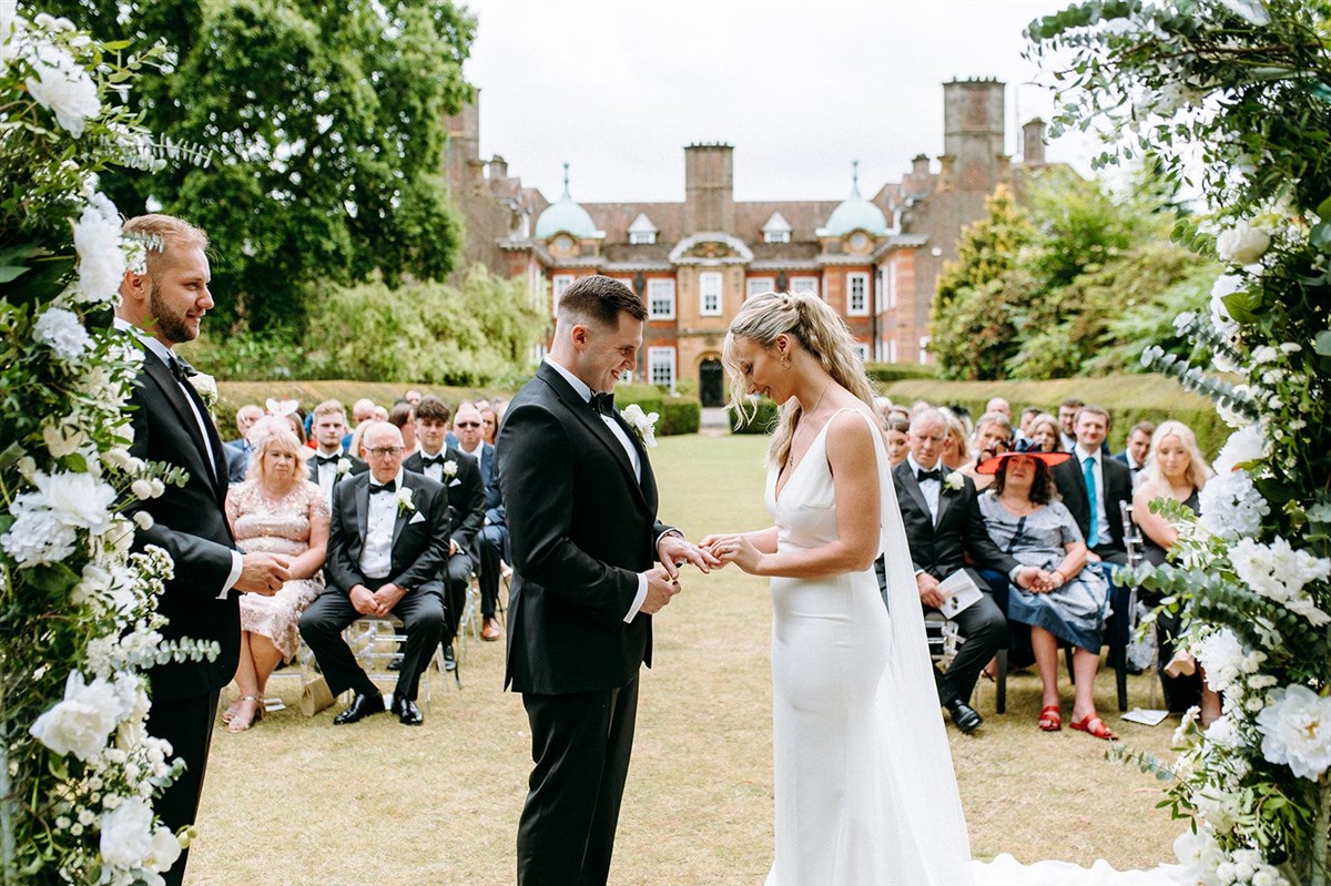 Couple exchanging vows on the Croquet Lawn