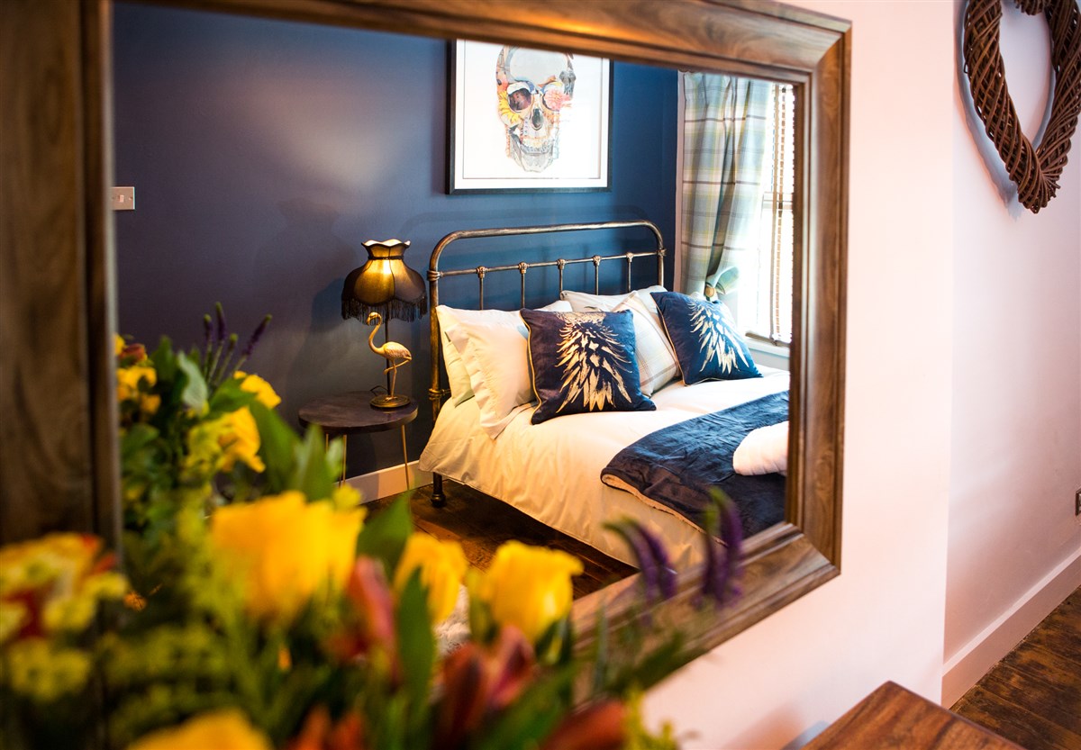 Main Bedroom reflected in dressing room mirror