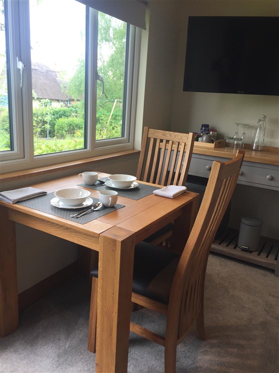 Breakfast table with view over meadow