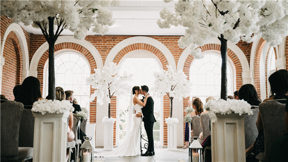 Bride & Groom exchanging vows in The Orangery