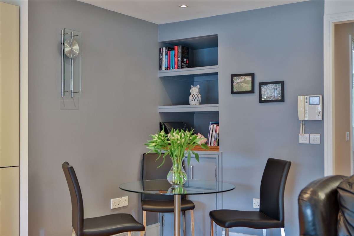 Leather chairs with glass topped table for quality dining