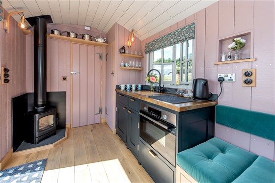 A Shaker style kitchen with an oven, hob & fridge