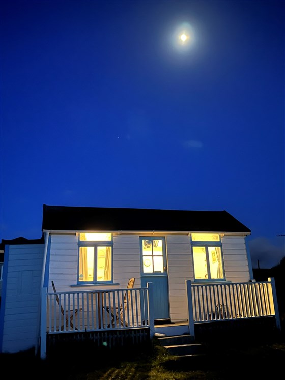 Sea Angel Beach Chalet Cornwall  under moonlight 