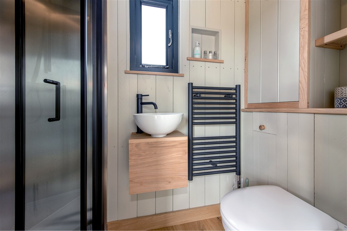 To one end of the hut there's a contemporary style shower room