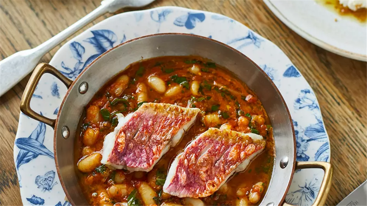 Grilled Cornish red mullet, with braised beans in a Livonian seafood stew.
