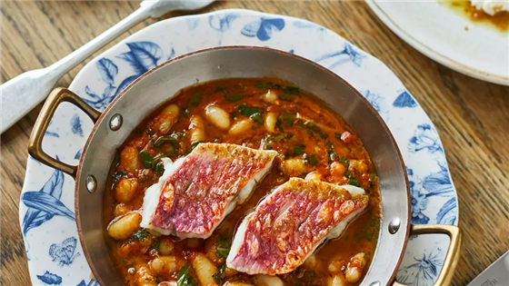 Grilled Cornish red mullet, with braised beans in a Livonian seafood stew.
