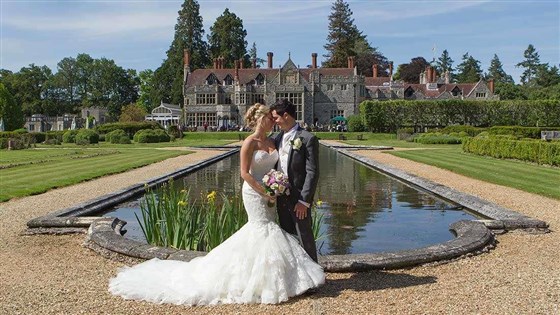 Bride and Groom by fountain