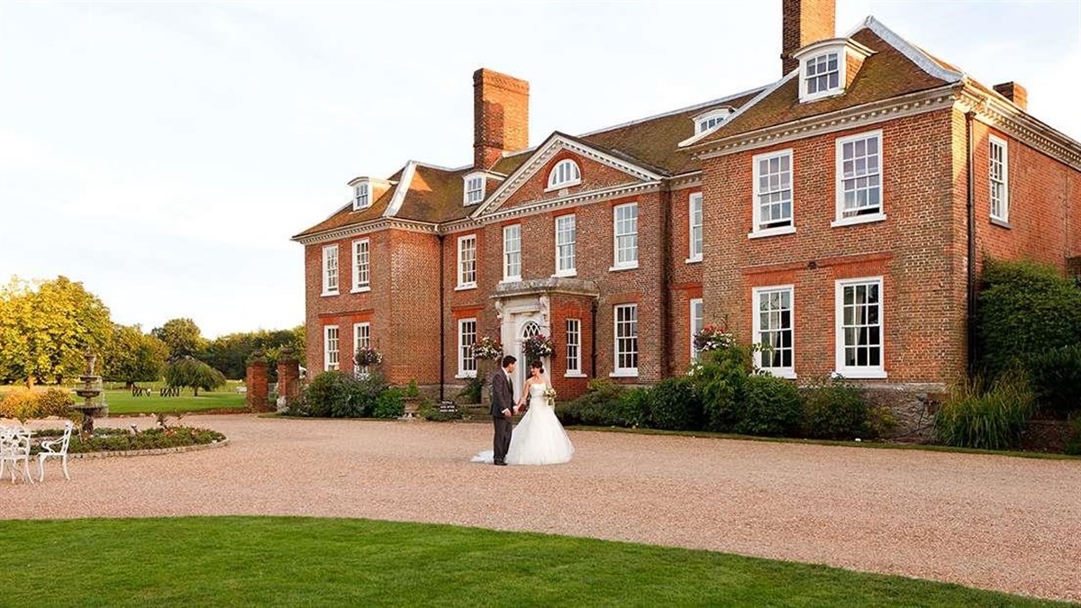 Bride and Groom in front of Chilston Park
