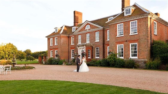 Bride and Groom in front of Chilston Park