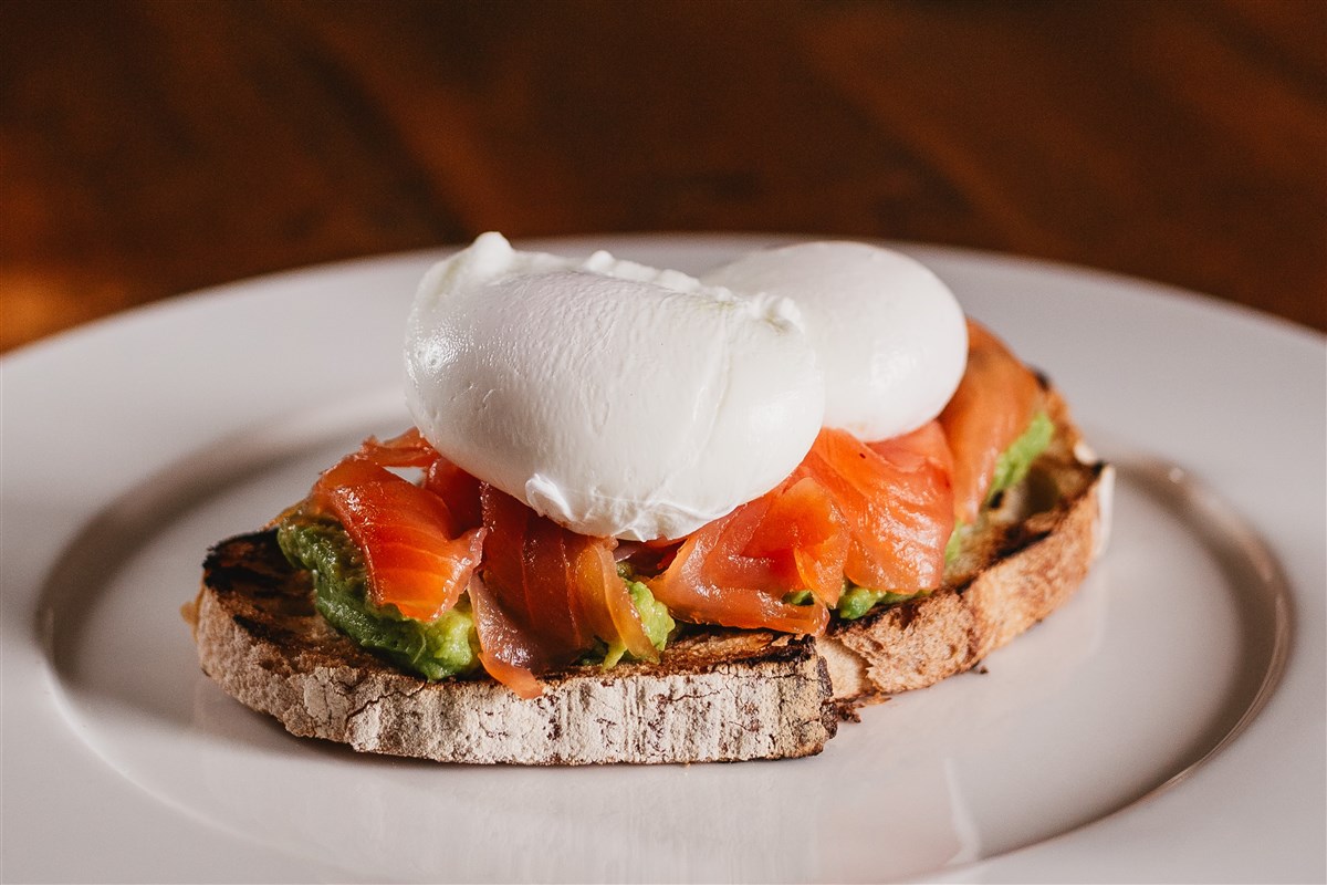 Crushed avocado, smoked salmon, poached eggs on toasted sourdough