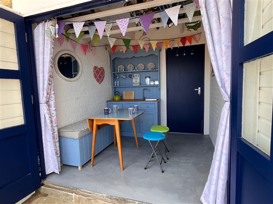 Inside of the hut - bench storage with buckets and spades!