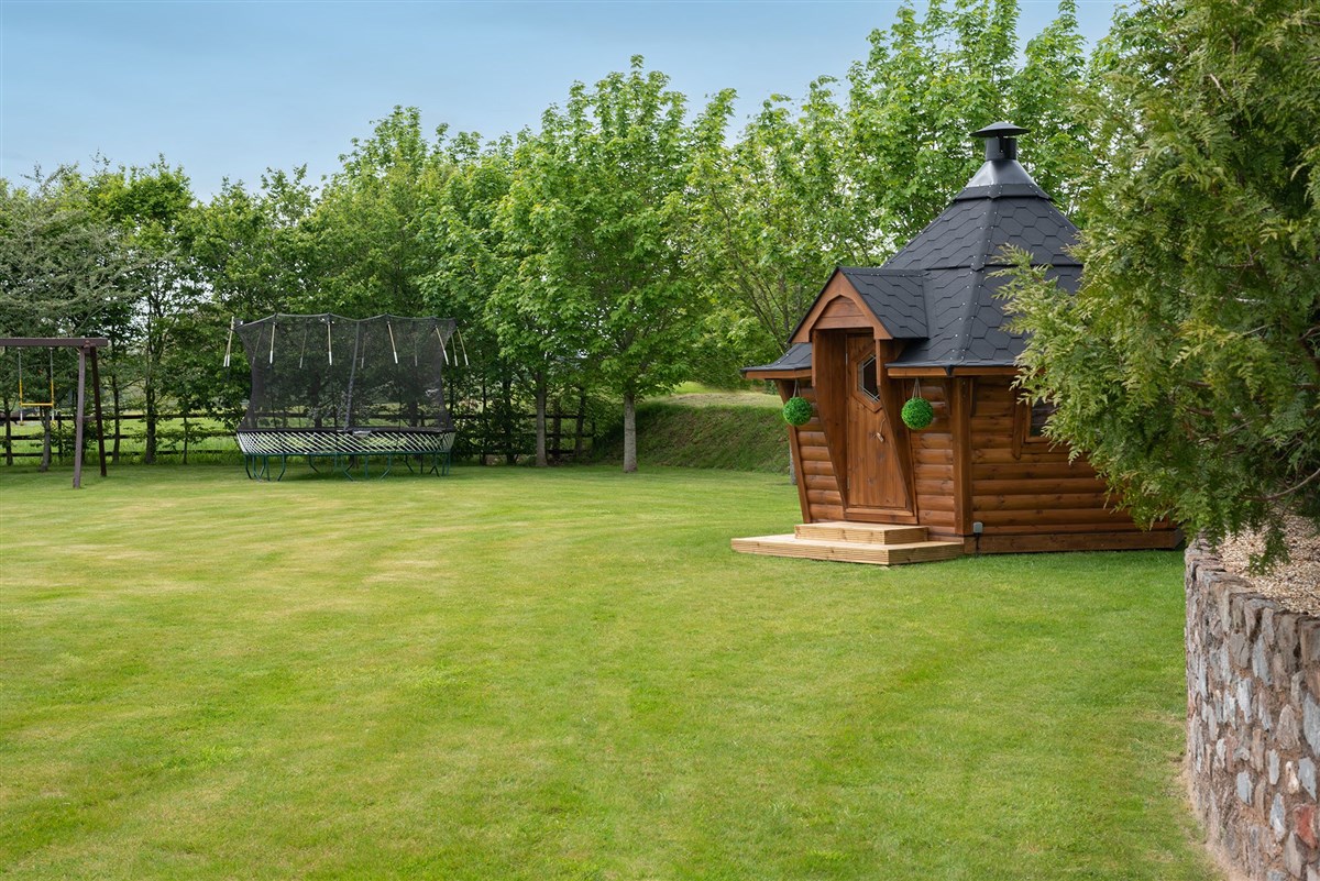 In the garden there's a cosy Scandi style BBQ Lodge for year round use