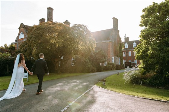 Couple walking up the drive