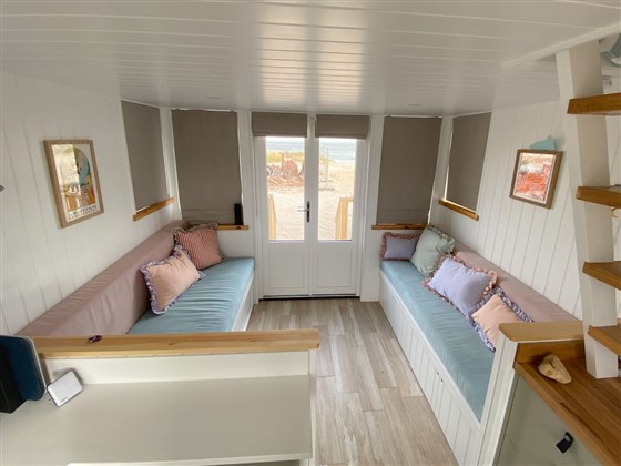 Interior view showing pull our bed and seating with storage