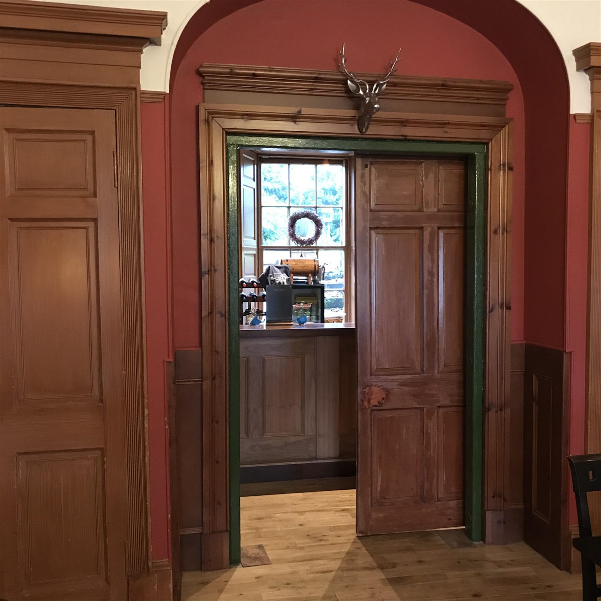 Whisky Bar guarded by Stags Head.